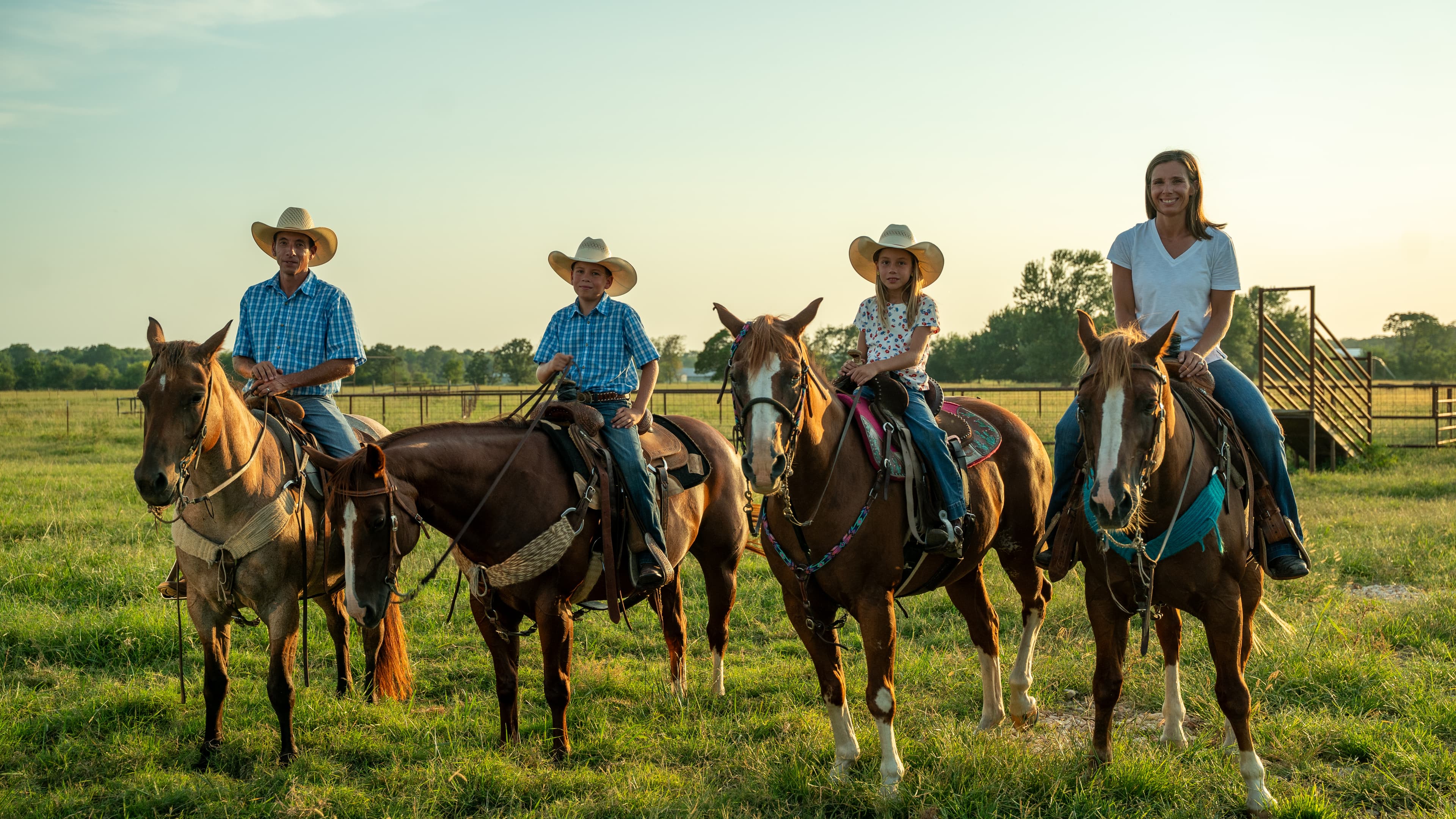 Smith family horseback riding on the ranch